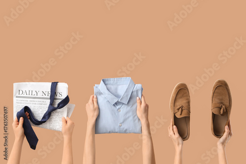 Young woman holding men's s...