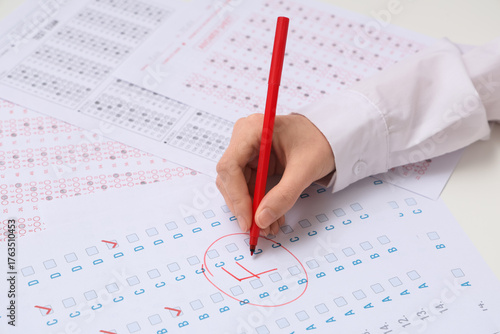 Female teacher writing resu...