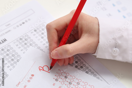 Female teacher writing resu...