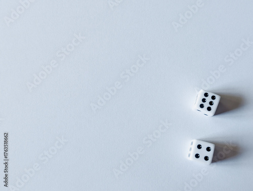 horizontal banner of two white dice showing six and four for business concepts