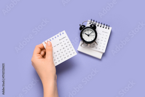 Female hand with calendar a...