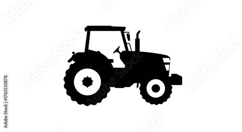 Silhouette of a farm tractor on white background