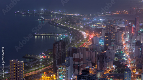 Wallpaper Mural Skyline with Skyscrapers day to night timelapse in Kuwait City downtown illuminated at dusk. Kuwait City, Middle East Torontodigital.ca