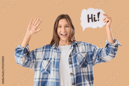 Young woman holding speech ...