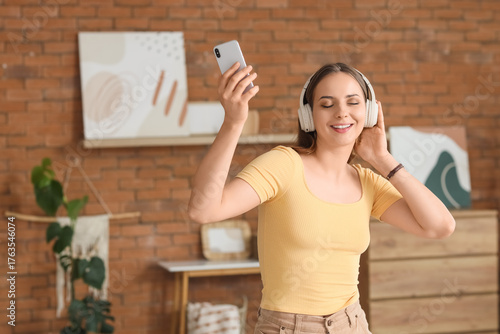 Young woman in headphones w...