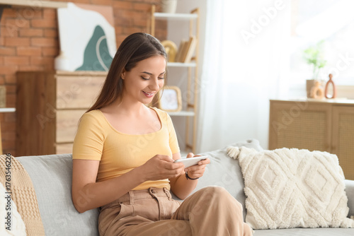 Young woman using mobile ph...