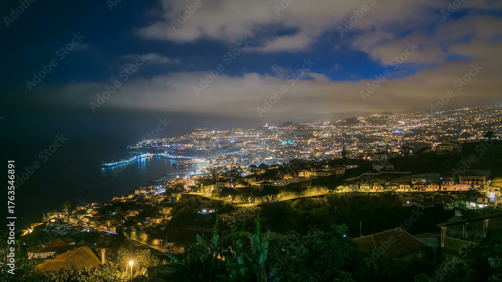 Obraz premium Island landscape after sunset panoramic view to Funchal, Madeira, Portugal timelapse