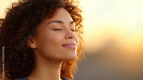 A close-up of a person face with eyes closed and a gentle smile, symbolizing a balanced and happy life. Mindfulness, positive thinking, and a growth mindset.