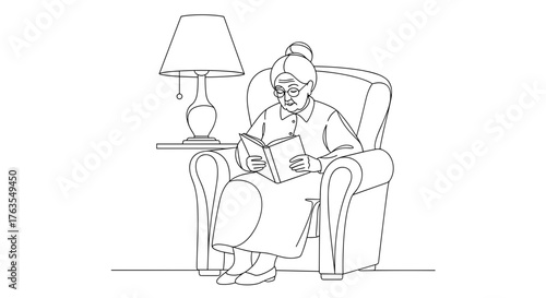 Elderly woman reading book on armchair in cozy living room, senior leisure and relaxation