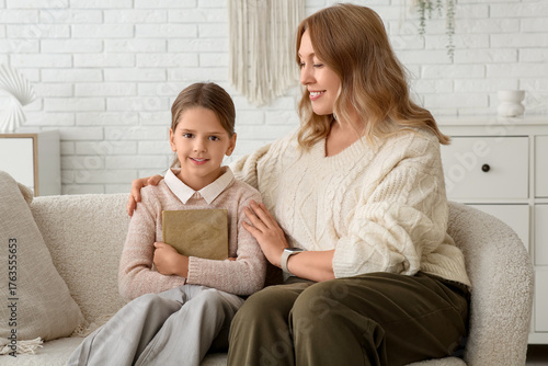 Little girl with book and t...
