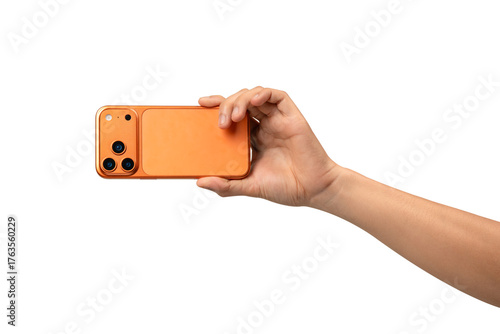 Back view of a hand holding a new cosmic orange smartphone, isolated on a transparent PNG.