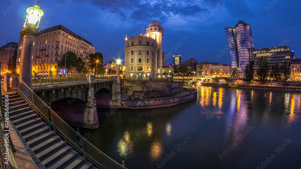 Naklejka premium Urania and Danube Canal day to night timelapse in Vienna.