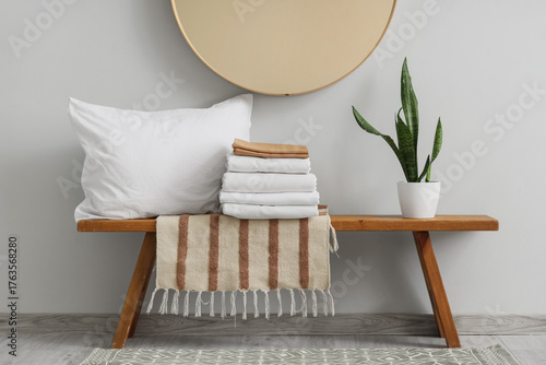 Bench with bed sheets, plan...