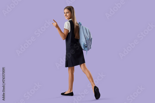 Teenage schoolgirl pointing...