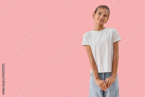 Dreamy teenage girl on pink...