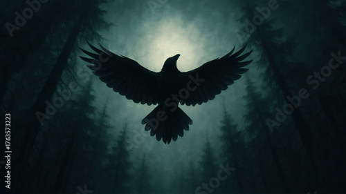 Fototapeta Naklejka Na Ścianę i Meble -  Mysterious silhouette of a raven with outstretched wings in a dark misty forest with ethereal light