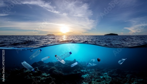 Fototapeta Naklejka Na Ścianę i Meble -  Underwater view of plastic bottle pollution in a coral reef contrasting with a serene ocean sunset