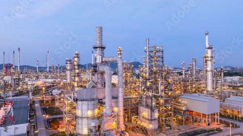 Aerial view oil and gas refinery plant at night, Oil and gas industrial petrochemical fuel power and energy at industry zone, Oil and gas refinery industrial energy supply chain.