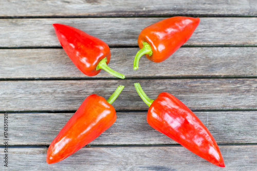 red hot chili peppers on wooden background