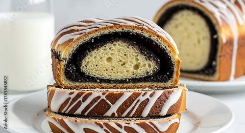 Delicious poppy seed roll cake with white icing drizzle