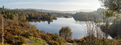 Welsh lake surrounded by forest in Fall