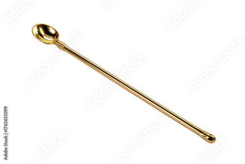 A gold spoon with a handle is sitting on a white background. The spoon is long and slender, with a rounded end. The spoon appears to be a decorative piece, possibly used for serving or stirring