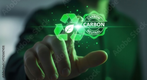Hand Touching Glowing Green Holographic Recycle Symbol