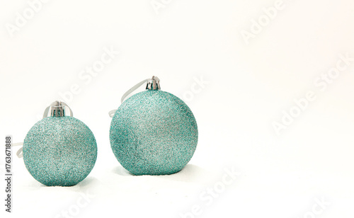 Christmas tree bauballs on snow on isolated on a white background.
