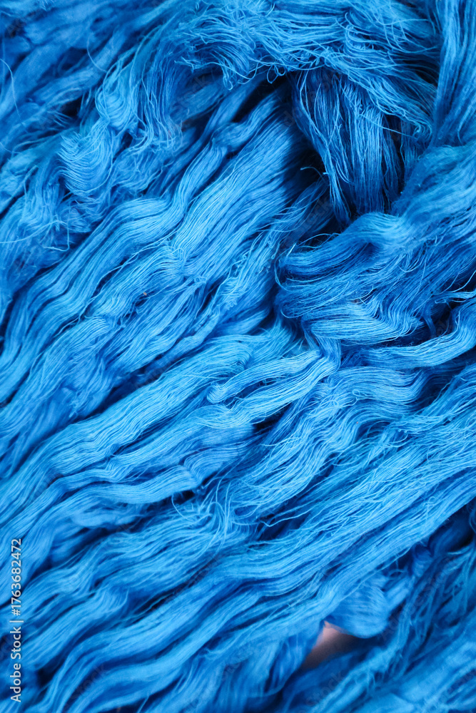 Fototapeta premium Natural cotton yarn. Hand-dyed skeins of yarn used for weaving. Handloom raw material.