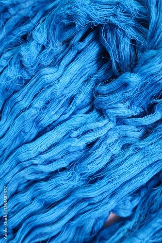 Natural cotton yarn. Hand-dyed skeins of yarn used for weaving. Handloom raw material.