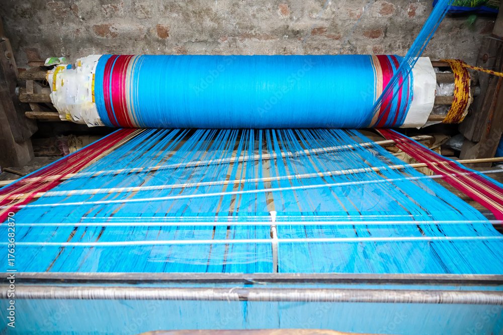 Fototapeta premium Vintage Handloom equipment or traditional setup for weaving. Cotton saree handloom and yarn.