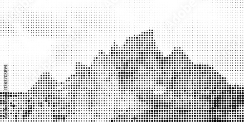 Grain halftone mountains. Fading dotted landscape and terrain. Black and white grainy hills. Grunge noise background. Textured wallpaper.
