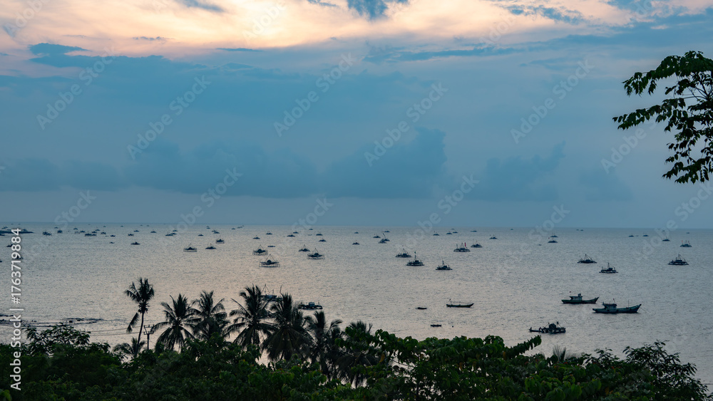 Naklejka premium beach view with fisherman boats in the evening