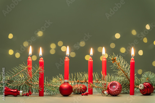 Christmas Candle Display, festive decoration reflecting holiday tradition and seasonal celebration. The concept  warmth, light and holiday spirit.