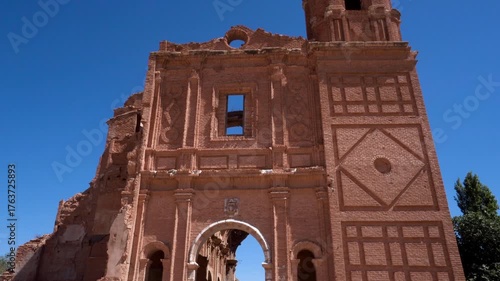 Ruins of the Convent of San Agustin in Belchite, Spain. The destroyed structure stands as a silent witness to the Spanish Civil War, showing weathered stone walls and haunting beauty under natural