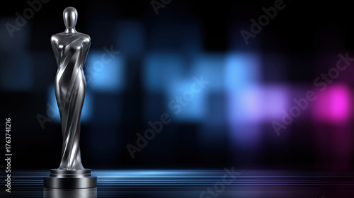 Shiny silver award statue on a dark background with colorful lights