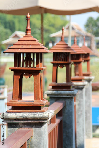 Row of antique wooden lamp on the handrail.
