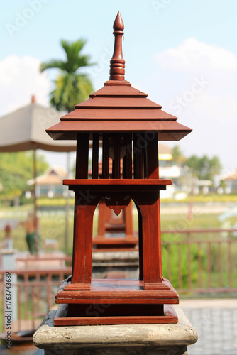 Row of antique wooden lamp on the handrail.