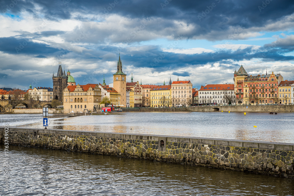 Obraz premium Prague, Czech republic - March 31, 2023. View over river to Smetanovo nabrezi