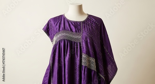 Elegant Purple Kaftan with Intricate White and Gold Stitching on Mannequin