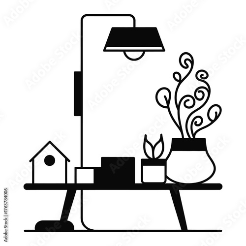 Black silhouette of a desk with lamp and plants table light
