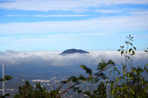 a view of Mount Zmeyka surrounded by clouds from the summit of Mount Mashuk in Pyatigorsk