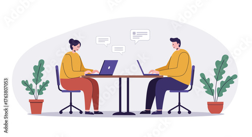 Colleagues working in modern office setting with laptops and plants