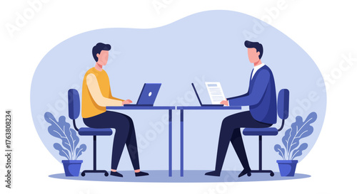 Modern office collaboration with two professionals using laptops at desks