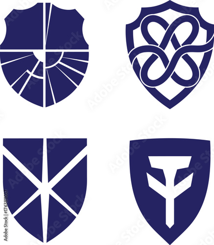 A collection of four navy blue heraldic shield emblems with unique abstract geometric, knotwork, and symbolic designs for logos and crests