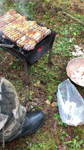 Barbecue is prepared outdoors. Cooking in the forest.