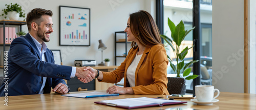 Real estate agent shakes hands with client in modern office mortgage contract signing investment housing forecast
