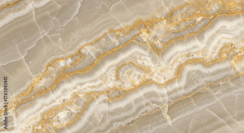 Luxurious beige marble surface with intricate golden veins displaying natural stone texture and elegant patterns