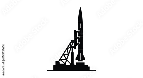 Black silhouette of a rocket on a launch pad structure
