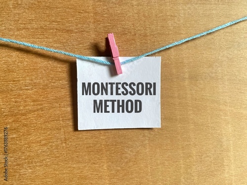A single piece of white paper with the words Montessori Method. Refers to the Montessori Method of Education, an approach to learning and child development created by Maria Montessori. 